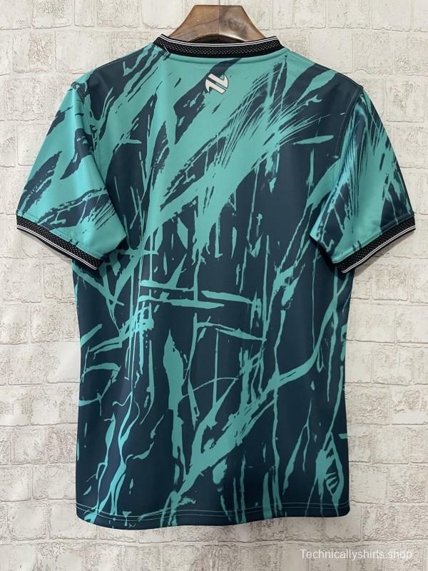 25/26 Tipperary GAA Teal with Warrior Silhouette and Abstract Brushstroke Pattern Jersey